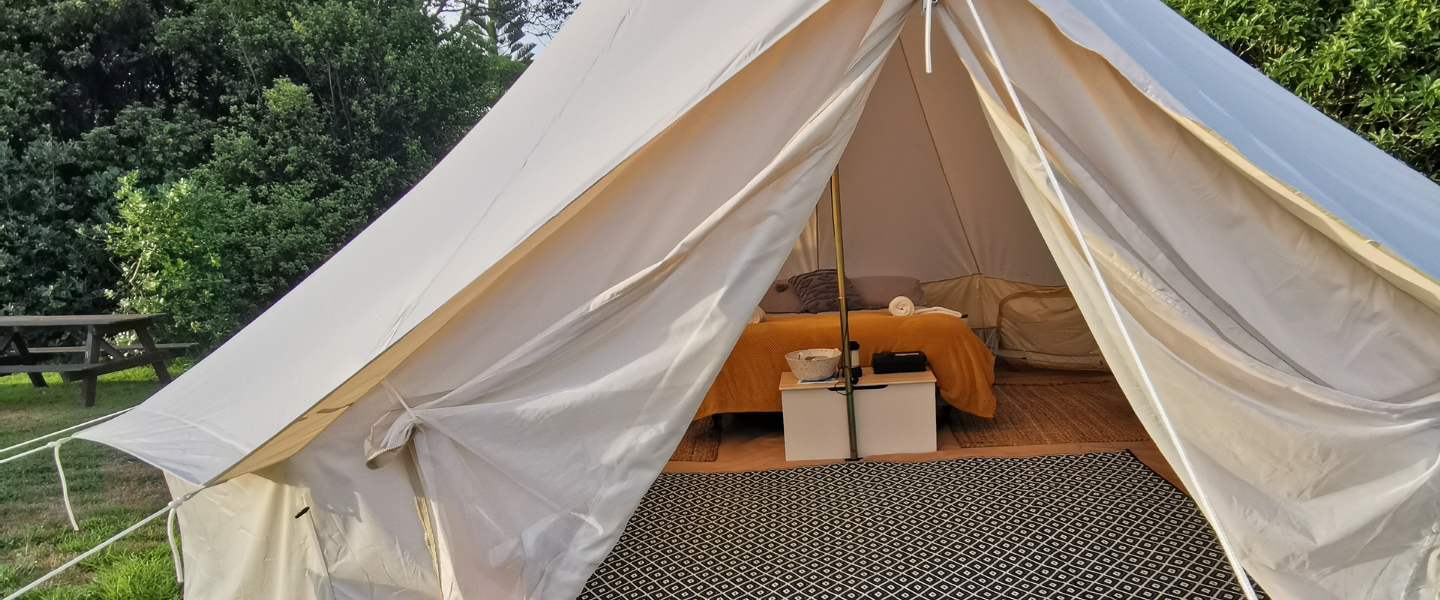Outside view of Pure Glamping tent at Onaero Bay